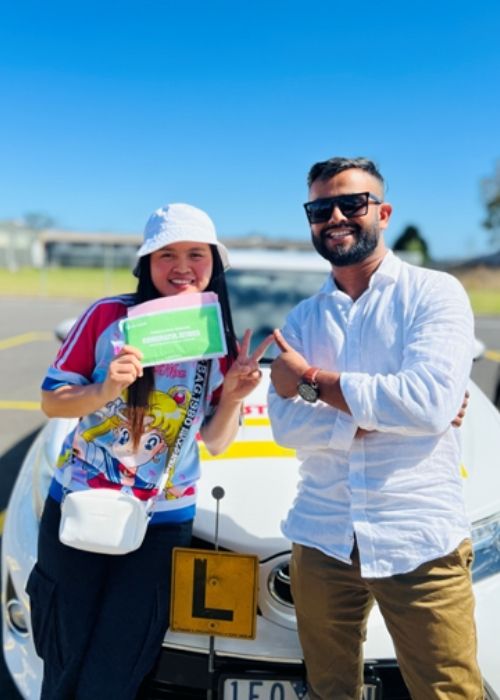 Our driving instructor and a learner in front of the driving car - Stop And Go Driving School